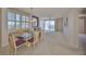 Bright condo living area with plantation shutters and sliding glass doors to the outside balcony at 7882 Sailboat Key S Blvd # 401, South Pasadena, FL 33707
