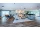 Well lit lounge area with modern furniture and calming blue color scheme at 7882 Sailboat Key S Blvd # 401, South Pasadena, FL 33707