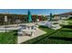 Outdoor grilling area with picnic tables, umbrellas, and barbecue grills for community use at 7882 Sailboat Key S Blvd # 401, South Pasadena, FL 33707