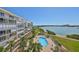 Stunning view of the pool, beach, and waterfront, perfect for relaxation at 7882 Sailboat Key S Blvd # 401, South Pasadena, FL 33707