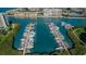 Overhead view of boat docks on a waterway with multiple boats berthed along the docks at 7882 Sailboat Key S Blvd # 401, South Pasadena, FL 33707