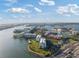 Beautiful aerial view of waterfront condos, community green space, and tennis courts on a sunny day at 7912 Sailboat Key S Blvd # 508, South Pasadena, FL 33707