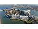 Gorgeous aerial view of waterfront condos, marina, community pool, and tennis courts at 7912 Sailboat Key S Blvd # 508, South Pasadena, FL 33707