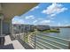Relax on this balcony with views of lush green space and bay waters under a bright blue sky at 7912 Sailboat Key S Blvd # 508, South Pasadena, FL 33707