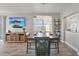 Dining room is equipped with a TV, elegant lightning and a great view at 7912 Sailboat Key S Blvd # 508, South Pasadena, FL 33707