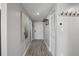 Inviting hallway with neutral paint, wood floors, and updated hardware, leading to main entry door at 7912 Sailboat Key S Blvd # 508, South Pasadena, FL 33707