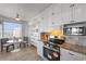 Bright kitchen with modern appliances, granite countertops, and scenic views from the adjacent dining area at 7912 Sailboat Key S Blvd # 508, South Pasadena, FL 33707