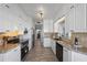 Contemporary kitchen featuring white cabinetry, stainless steel appliances, and modern lighting at 7912 Sailboat Key S Blvd # 508, South Pasadena, FL 33707