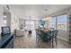Spacious living area with water views, wood floors, modern furnishings, and a dining table create a perfect living space at 7912 Sailboat Key S Blvd # 508, South Pasadena, FL 33707