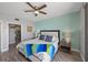 Comfortable main bedroom with a ceiling fan, side tables, and ensuite bathroom at 7912 Sailboat Key S Blvd # 508, South Pasadena, FL 33707