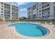 Community pool offering clear blue waters and views of the surrounding condos at 7912 Sailboat Key S Blvd # 508, South Pasadena, FL 33707