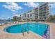Community pool with views of the condominium and waterfront at 7912 Sailboat Key S Blvd # 508, South Pasadena, FL 33707