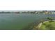 Scenic waterfront view featuring calm water, a distant cityscape, and lush green trees in the foreground at 7912 Sailboat Key S Blvd # 508, South Pasadena, FL 33707