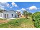 Spacious backyard featuring lush greenery and ample space for outdoor activities and potential landscaping opportunities at 8561 Deer Chase Dr, Riverview, FL 33578