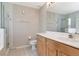 Main bathroom featuring a glass shower, white countertop, and wooden cabinets at 8561 Deer Chase Dr, Riverview, FL 33578