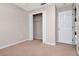 Spare bedroom with an open closet and bright white trim with neutral walls and carpet at 8561 Deer Chase Dr, Riverview, FL 33578