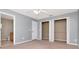 Bright bedroom with an open closet and access to the bathroom with a neutral color palette at 8561 Deer Chase Dr, Riverview, FL 33578