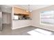 Dining Area features luxury vinyl plank flooring, a window for natural light, and a passthrough to the kitchen at 8561 Deer Chase Dr, Riverview, FL 33578