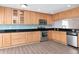 Corner view of an open kitchen with stainless steel appliances and sleek countertops at 8561 Deer Chase Dr, Riverview, FL 33578