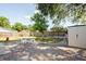 A pleasant backyard with brick patio, lawn, a storage shed, and fencing at 9118 108Th Ave, Seminole, FL 33777