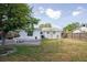 Well-maintained backyard with brick patio, lawn, and perimeter fencing at 9118 108Th Ave, Seminole, FL 33777