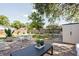 Outdoor patio with furniture and storage shed in fenced-in backyard at 9118 108Th Ave, Seminole, FL 33777