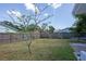 A well-maintained backyard with a wooden fence, offering privacy and a serene outdoor space at 9118 108Th Ave, Seminole, FL 33777