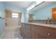 Well-lit bathroom featuring a double vanity and bath/shower combination at 9118 108Th Ave, Seminole, FL 33777