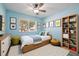 Brightly staged bedroom with a twin bed, dresser, bookshelf, and decorative elements at 9118 108Th Ave, Seminole, FL 33777