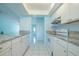 Bright kitchen featuring white cabinets, granite countertops, and stainless steel appliances at 9118 108Th Ave, Seminole, FL 33777