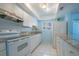 Bright kitchen features white cabinetry, granite countertops, and stainless steel appliances at 9118 108Th Ave, Seminole, FL 33777