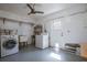 Functional laundry room with sink, washer, dryer, and ample storage space at 9118 108Th Ave, Seminole, FL 33777