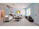 Bright and airy living room featuring a neutral color palette, stylish decor, and tile flooring at 9118 108Th Ave, Seminole, FL 33777