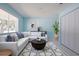 Comfortable living room with a white sofa, area rug, and natural light at 9118 108Th Ave, Seminole, FL 33777
