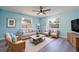 Cozy living room filled with plenty of seating and lots of natural light at 9118 108Th Ave, Seminole, FL 33777