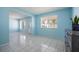 Open floorplan living room features tile floors, bright windows, and ample natural light at 9118 108Th Ave, Seminole, FL 33777