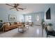 Bright, stylish living room with modern furnishings, tile floors and ample natural light at 9118 108Th Ave, Seminole, FL 33777