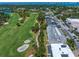 Scenic aerial view of real estate close to a lush golf course at 919 Osceola Rd # 202, Belleair, FL 33756