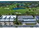 Beautiful aerial view of real estate near a lush golf course and convenient parking at 919 Osceola Rd # 202, Belleair, FL 33756