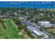Breathtaking aerial view capturing real estate near a beautiful golf course and the ocean at 919 Osceola Rd # 202, Belleair, FL 33756