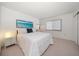 Bright bedroom with natural light, closet and a clean, minimalist design at 919 Osceola Rd # 202, Belleair, FL 33756