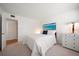 Comfortable bedroom featuring a plush queen bed and a calming ocean view print at 919 Osceola Rd # 202, Belleair, FL 33756