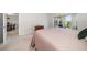 Bedroom with a cozy bed, closet, and view of the outdoor patio at 919 Osceola Rd # 202, Belleair, FL 33756