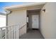 Front door of a well maintained property with clean lines and a modern aesthetic at 919 Osceola Rd # 202, Belleair, FL 33756