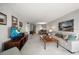 Spacious living room with neutral colors, comfortable seating, and views into the dining area, creating a relaxing atmosphere at 919 Osceola Rd # 202, Belleair, FL 33756