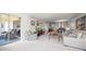 Inviting living room featuring a large window, plush seating, and elegant decor at 919 Osceola Rd # 202, Belleair, FL 33756
