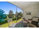 Relaxing outdoor patio with seating and a scenic view of the golf course at 919 Osceola Rd # 202, Belleair, FL 33756