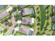 Aerial view of neighborhood homes, showcasing a community with pools, manicured lawns, and tree-lined streets at 1134 Tracey Ann Loop, Seffner, FL 33584