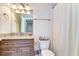 This bathroom features a granite countertop vanity and shower-tub combo at 1134 Tracey Ann Loop, Seffner, FL 33584