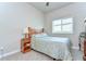 This bedroom features a ceiling fan, plush carpet, and a window at 1134 Tracey Ann Loop, Seffner, FL 33584
